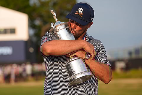 Bryson DeChambeau holds US Open trophy
